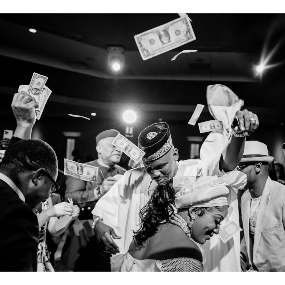 Bride and Groom getting sprayed money