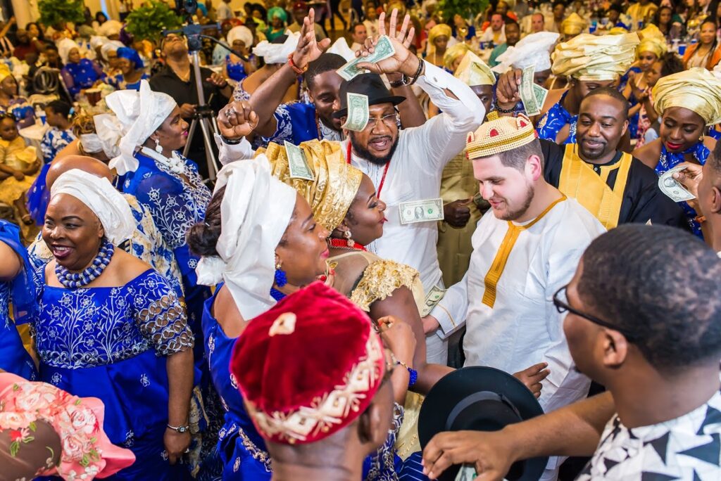 Groom and Bride while Money Spraying in Nigerian Wedding Tradition