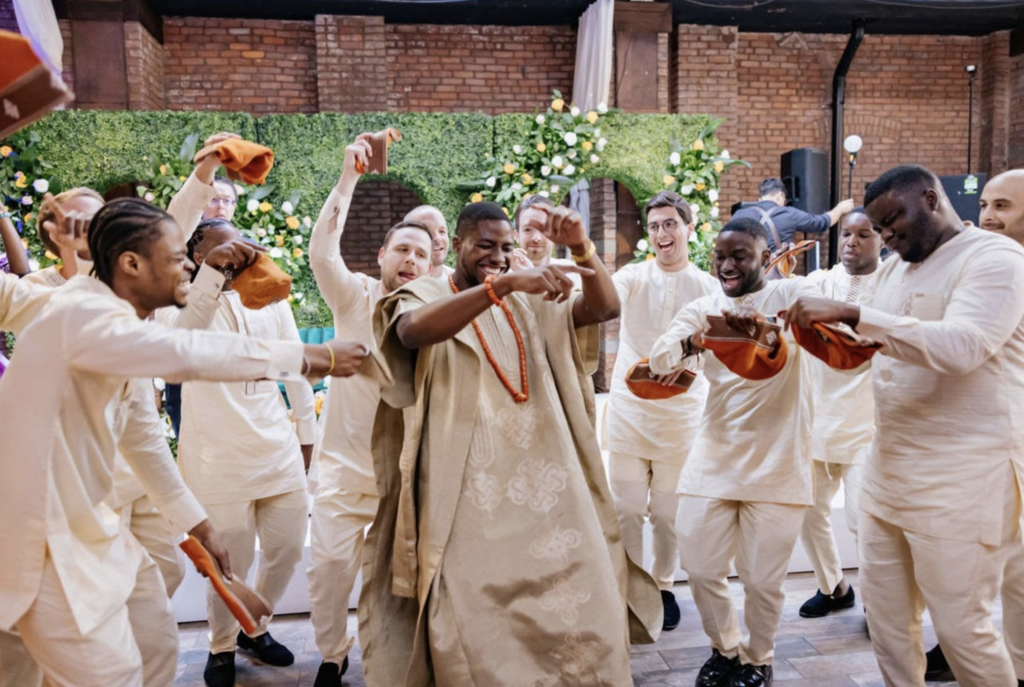 Grooma nd aso ebi members during traditional wedding