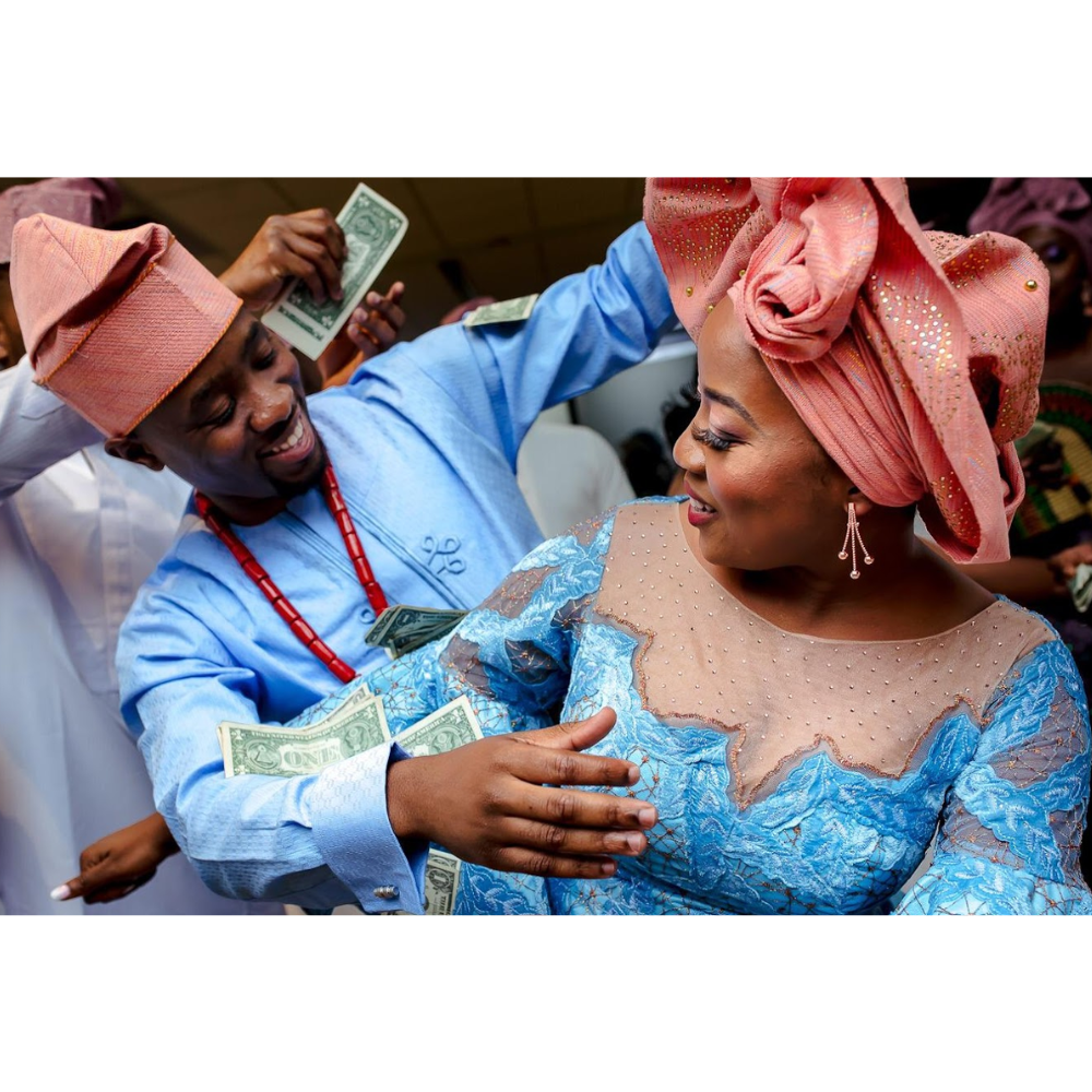 The Bride and Groom Getting Sprayed Money