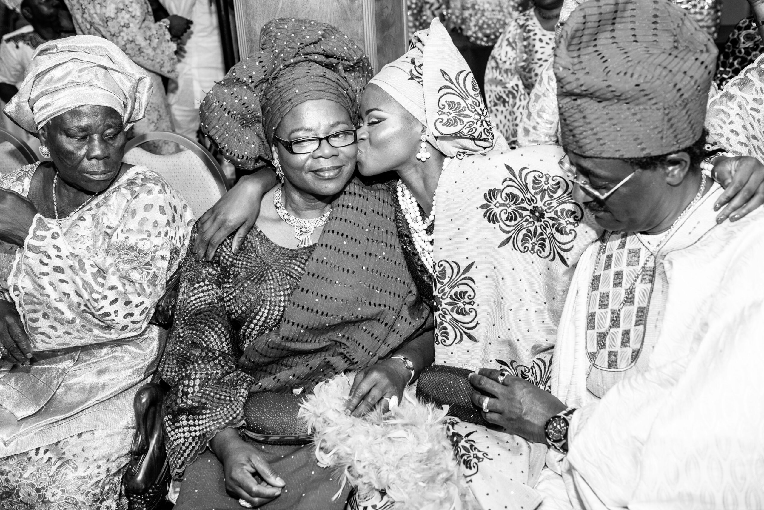 Bride Cries and Kisses Parents During Wedding Reception