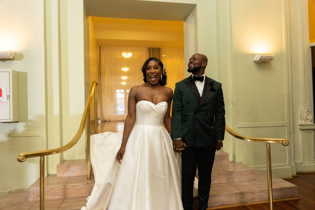 Couple Walking Down Stairs for Wedding Reception Viewing Showcase