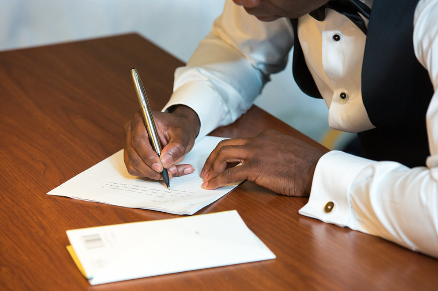 Groom-writing-vows-and-letters